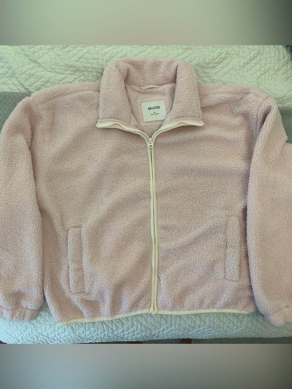 Hollister Light Pink fleece Zip-Up Jacket with white trim at zipper and bottom